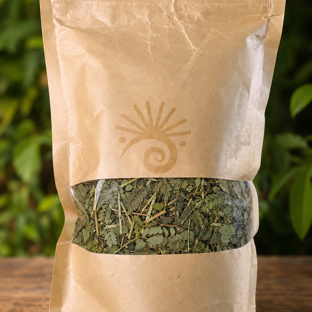 Kraft paper packaging with dried herbs on a wooden surface and green leafy background